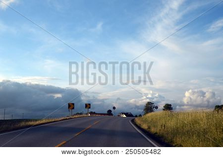 
A typical Norwegian road in the countryside. June 16. 2018. Ostfold Region, Norway