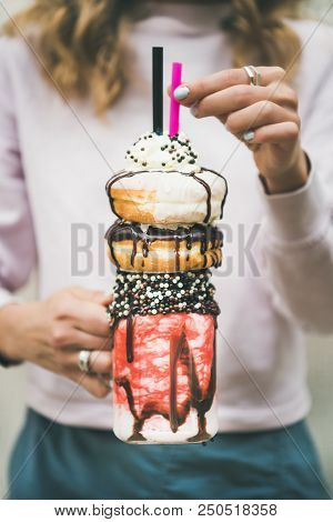 Young Female Holding Summer Cold Strawberry Donut Freakshake In Mason Jar In Hands, Selective Focus