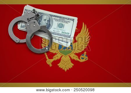 Montenegro Flag  With Handcuffs And A Bundle Of Dollars. The Concept Of Breaking The Law And Thieves