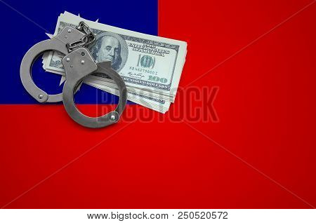 Taiwan Flag  With Handcuffs And A Bundle Of Dollars. The Concept Of Breaking The Law And Thieves Cri
