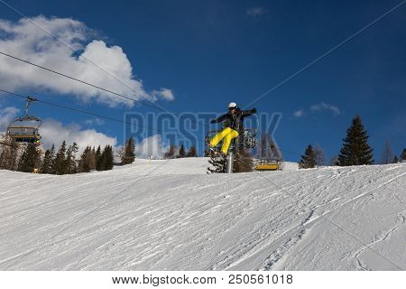 Bolzano, Italy - February 2018: Skier In Action: Ski Jumping In The Mountain Snowpark.