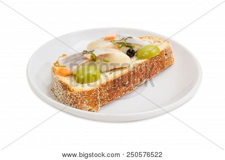 Open Sandwich Made Of Brown Wheaten Sprouted Bread, Slices Of Fillet Of Pickled Atlantic Herring And