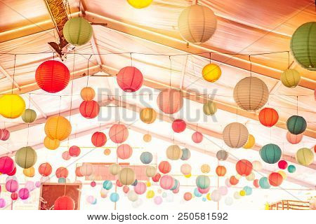Bright Background With Many Colorful Chinese Round Lantern Decorating The Ceiling Of Hall At Celebra