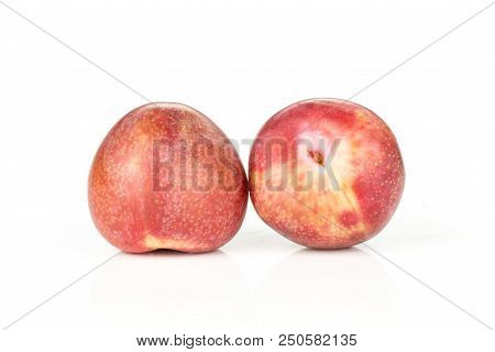 Group Of Two Whole Fresh Pluot Interspecific Plums Variety Isolated On White