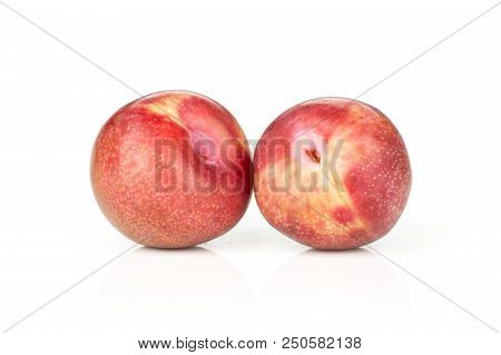 Group Of Two Whole Fresh Pluot Interspecific Plums Variety Isolated On White