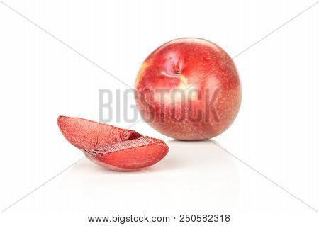 Group Of One Whole Two Slices Of Fresh Pluot Interspecific Plums Variety Isolated On White