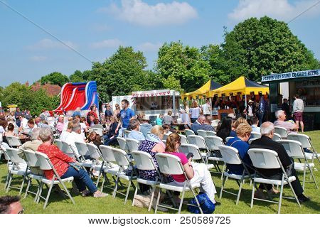 TENTERDEN, ENGLAND - MAY 20, 2018: People enjoy the annual Food and Drink Festival at Tenterden in Kent. The event was first held in 2017.