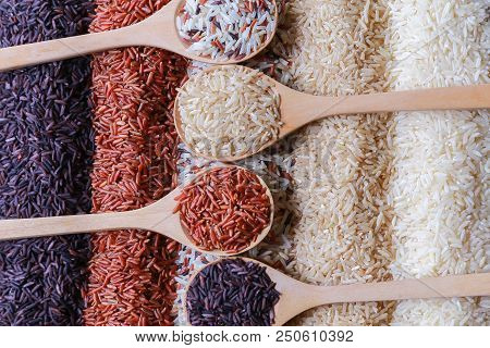 Food Background With Top View Of Five Rows Of Rice In A Wooden Spoon.