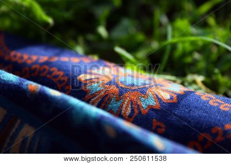 Fabric With A Colorful Pattern On The Grass