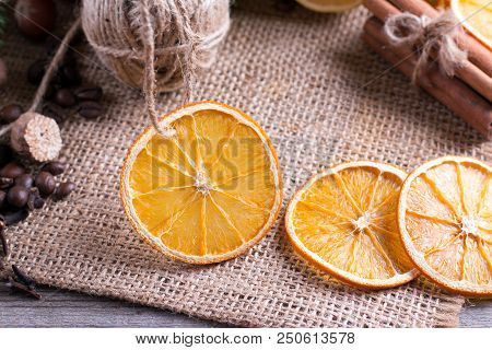 Dried Orange On Wooden Background. Rings Of Dried Citrus On Table.