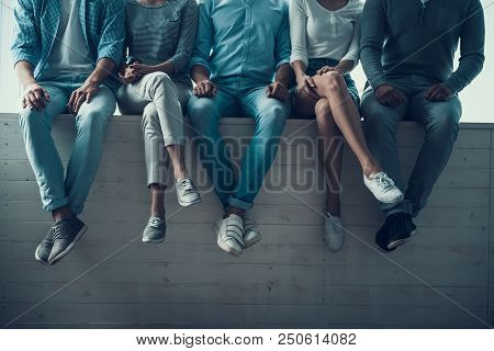 Young Multiethnic Students Sitting In White Hall At College. Team And Teamwork Concepts. Friends In 