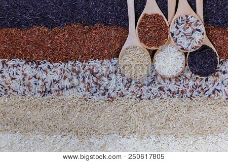 Food Background With Top View Of Five Rows Of Rice In A Wooden Spoon.