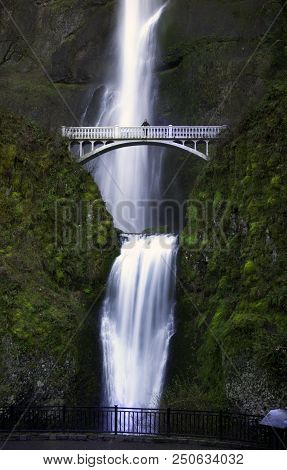 Woman Stand On The Bridge That Span Multnomah Falls, Oreogn