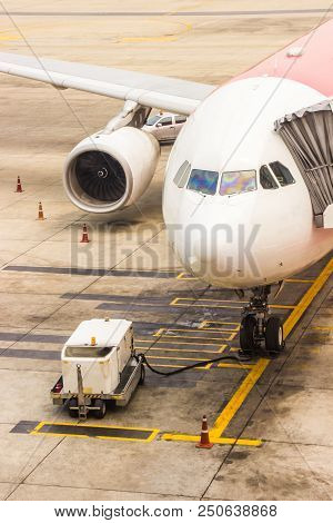 Aircraft Maintenance Main Gear Checking In The Airport Before Departure For Safety. Preflight Servic
