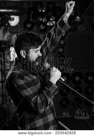 Hipster Likes To Sing On Stage. Man With Enthusiastic Face Holds Microphone, Singing Song, Karaoke C