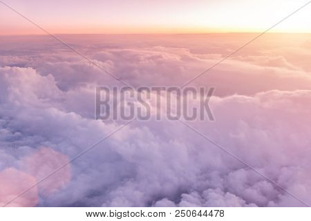 Sunset sky with beautiful clouds from the airplane window