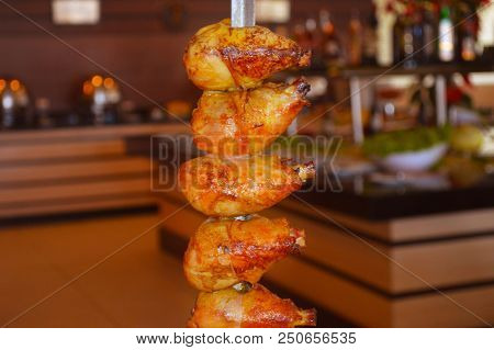 Chicken Thighs On Skewers Being Served In Carvery Of Noble Meats