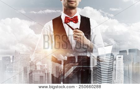 Double Exposure Of Confident And Young Businessman In Smart-casual Wear Smoking Pipe And Modern City
