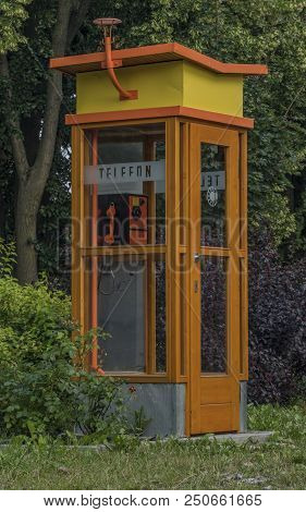 Old Phone On Street In Trest Town In Summer Evening