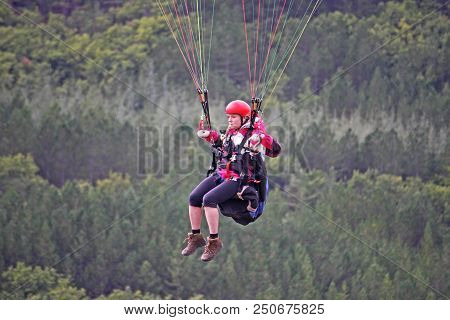Paraglider In Her Harness In The French Alps