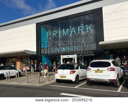 Llanelli, Wales, Uk: July 23, 2018: Shoppers Enter A Primark Shop. Primark Is A Discount Fashion Cha