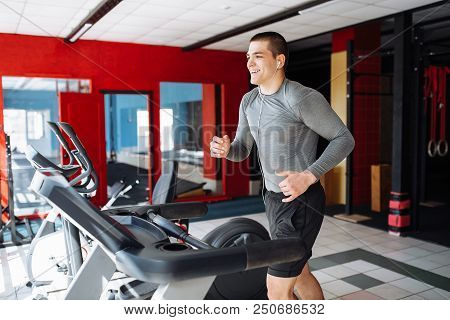 Nice Beefy Young Man, Engaged In Sports, Treadmill, Morning Exercise