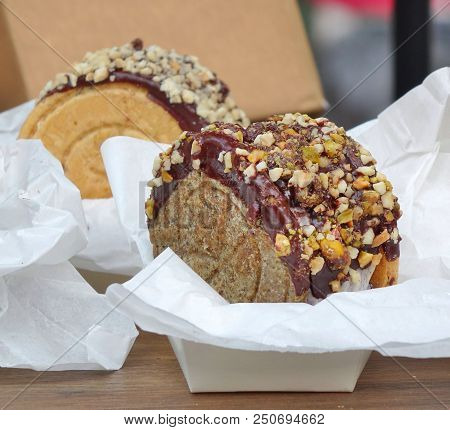Delicious Cake With Chocolate Glaze And Nuts