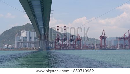 Kwai Tsing, Hong Kong, 02 May 2018:- Cargo ship passing the harbor and Kwai Tsing Container Terminal in Hong Kong 