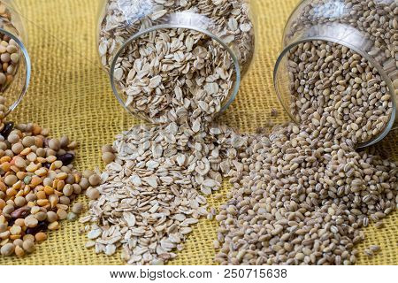 Glass Jars With Various Legumes - Beans, Oatmeal Flakes, Peas And Lentils. Cooking, Diet, Vegan And 