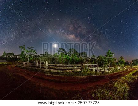 Milky Way And Fullmoon Over Dirt Road On The Mountain In Country Side