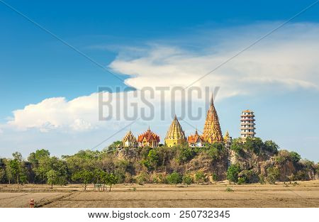 Big Buddha Temple, Wat Tham Suea, On Mountain Behind Dry Rice Field Kanchanaburi Thailand