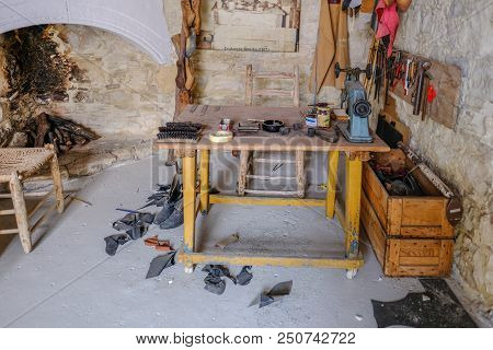 Lania, Cyprus - May 13, 2018: View Of The Preserved Shoe Makers Workshop In The Village Of Lania. Sh