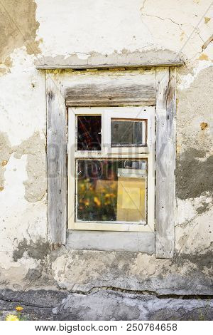 Old Weathered Rough Wall With Wooden Window. Natural Vintage Dirty Texture. Specially Preserved Rura