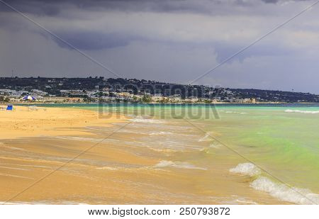 The Most Beautiful Sandy Beaches Of Apulia (italy): In The Background The Marine Of Torre Vado.