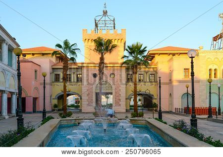 Sharm El Sheikh, Egypt - May 12, 2018: Unknown Man Is Resting On Bench By Fountain In Business And S