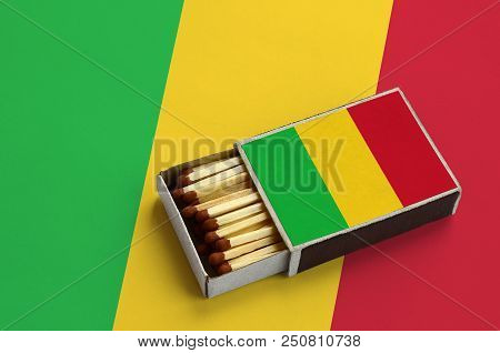 Mali Flag  Is Shown In An Open Matchbox, Which Is Filled With Matches And Lies On A Large Flag.