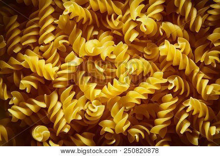 Raw Uncooked Dry Italian Fusilli Pasta. Corkscrew Spiral Shape