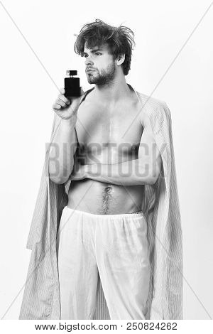 Handsome Young Man Using Perfume Isolated On White Background
