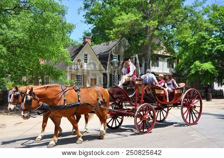 Williamsburg, Va, Usa - May 7, 2012: Horse Drawn Carriage Tours In British Colony In Williamsburg, V
