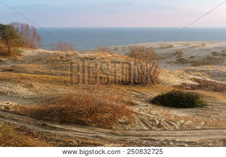 Sand Dune At Sunset, The Sea, The Hills Of Sand In The Sunlight