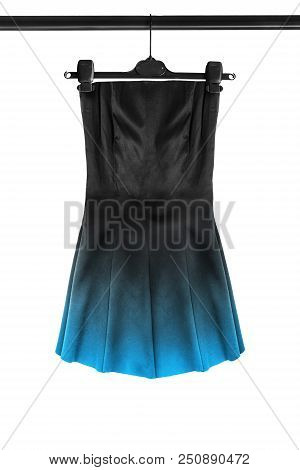 Black Satin Mini Strapless Dress With Blue Skirt Hanging On Clothes Rack Isolated Over White
