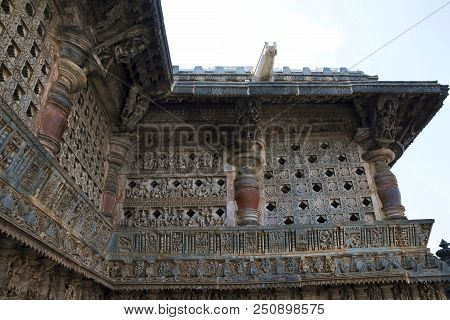 Ornate Perforated Window And Madanikas, Salabhanjika Meaning Celestial Damsels, On Top Of The Pillar