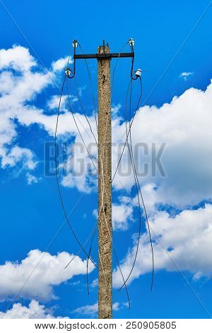 Disconnected Electric Line In Russian Village.old Power Line Post With Ripped Electric Wires Hanging