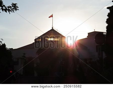 Sun Sunset Over Polish Senate And Parliament Building, Warsaw, Poland