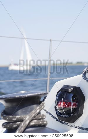 Compass With Sailboat, Makes You Wonder: Where Do We Go From Here?