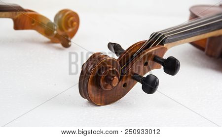 Closeup The Construction Of Violin,scroll,pegbox And Neck,on White Background.