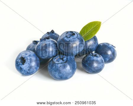 Blueberries Isolated On White Background. Extreme Close Up View Of Heap Blueberry Berries With Green
