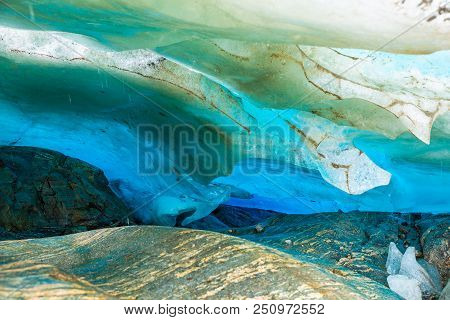 Blue Ice Cave Of Svartisen Glacier In Norway