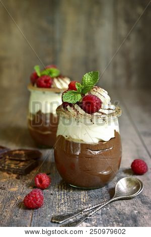 Chocolate Mousse With Whipped Cream And Fresh Raspberry.