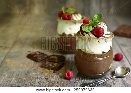 Chocolate Mousse With Whipped Cream And Fresh Raspberry.